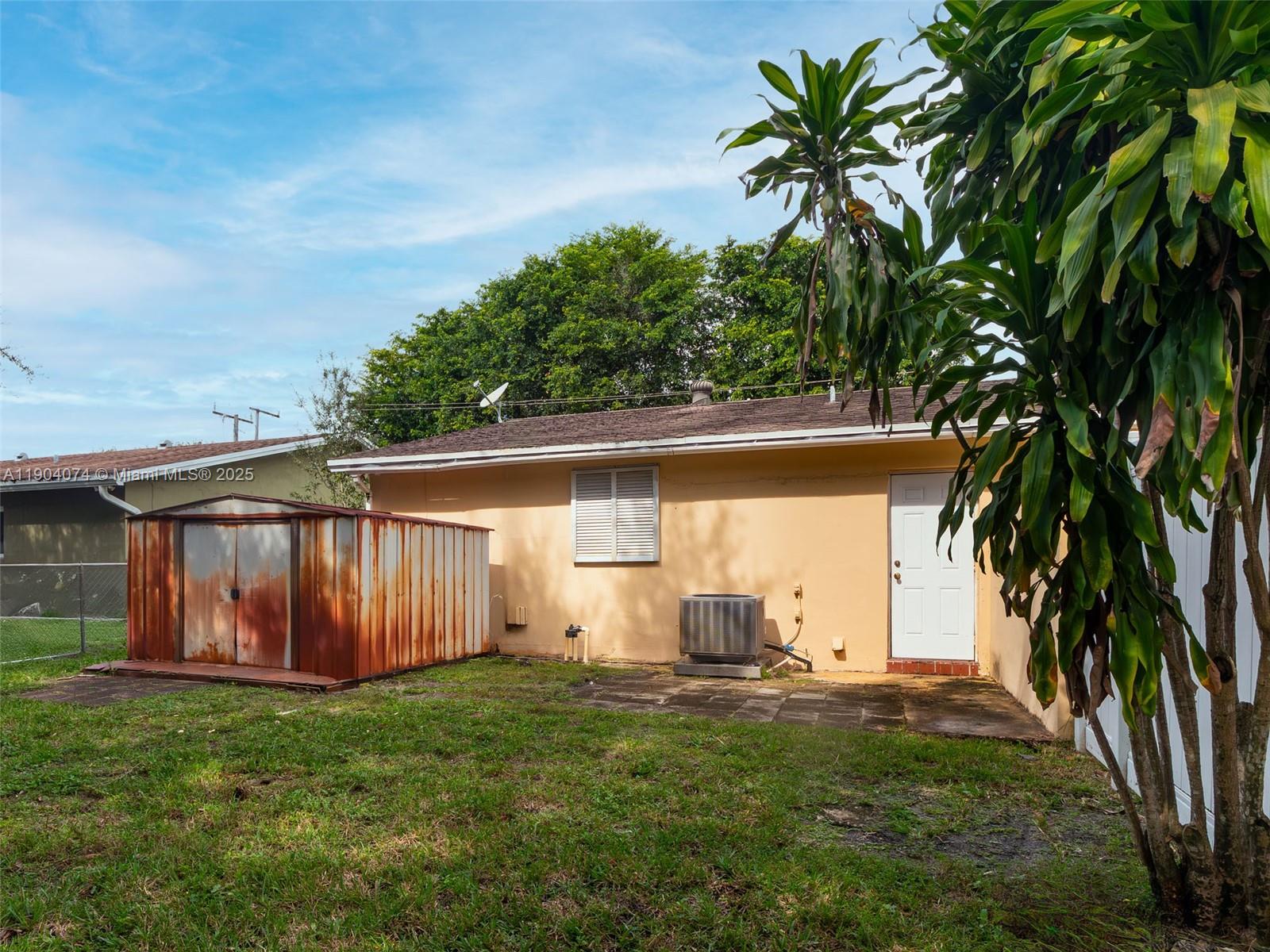 6510 Southwest 49th Street Davie, FL 33314 - Photo 26 of 26 a view of backyard with potted plants and large tree