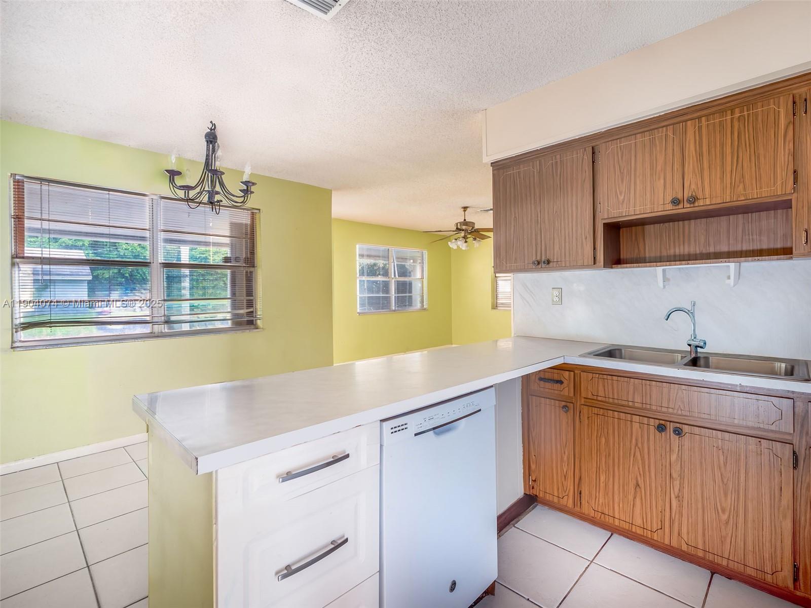 6510 Southwest 49th Street Davie, FL 33314 - Photo 6 of 26 a kitchen with a sink and cabinets