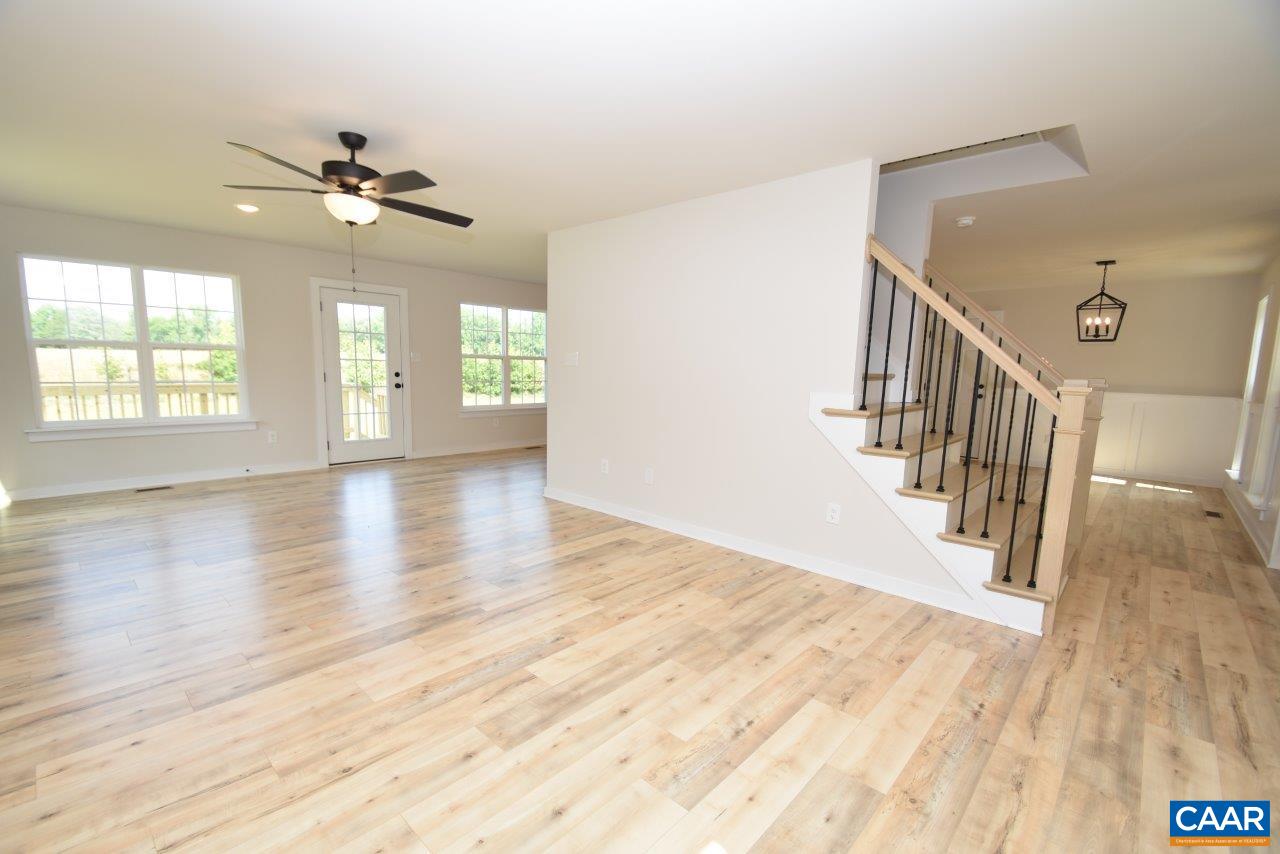 11675 Jack Jouett Road West Zion Crossroads, VA 22942 - Photo 11 of 32 a view of an empty room with wooden floor and a window