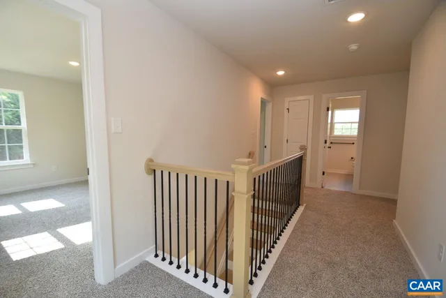 a view of a hallway with windows