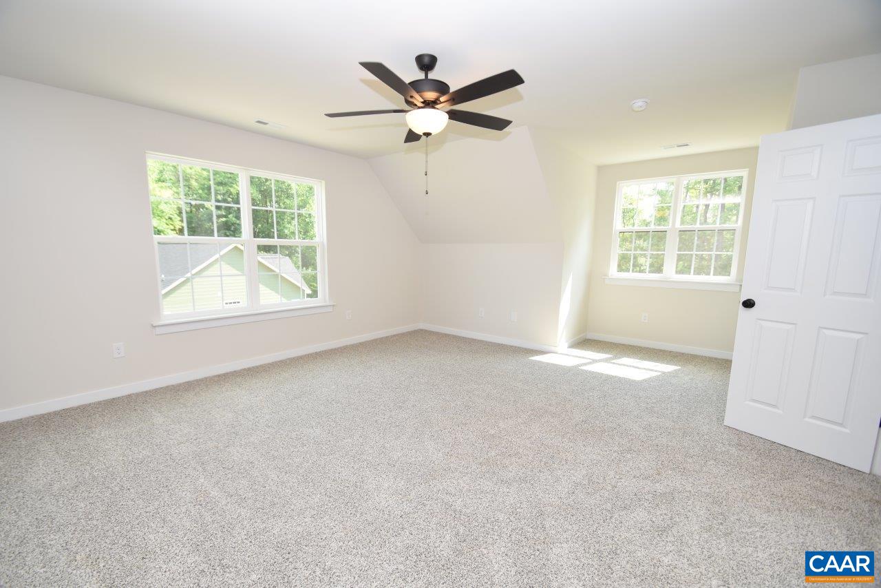 11675 Jack Jouett Road West Zion Crossroads, VA 22942 - Photo 23 of 33 an empty room with a ceiling fan and window