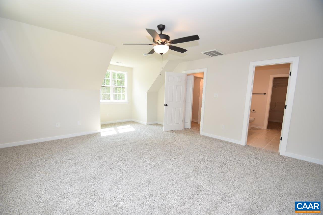 11675 Jack Jouett Road West Zion Crossroads, VA 22942 - Photo 24 of 32 a view of a livingroom with a ceiling fan and window