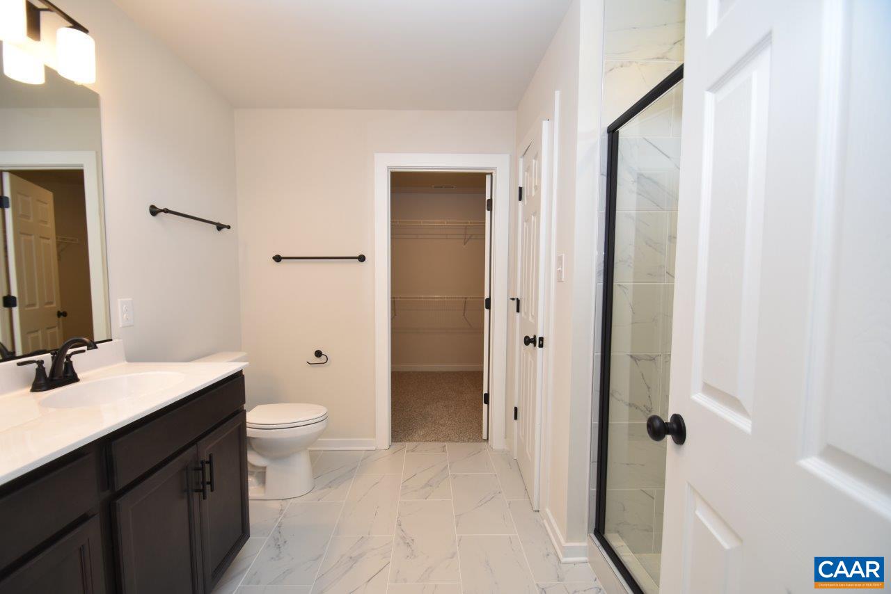 11675 Jack Jouett Road West Zion Crossroads, VA 22942 - Photo 28 of 32 a bathroom with a toilet a sink and a mirror