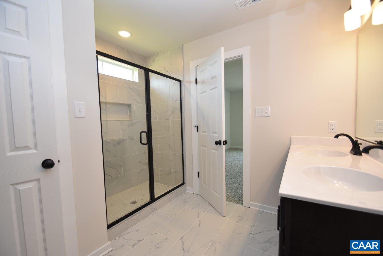 11675 Jack Jouett Road West Zion Crossroads, VA 22942 - Photo 29 of 32 a bathroom with a sink and mirror