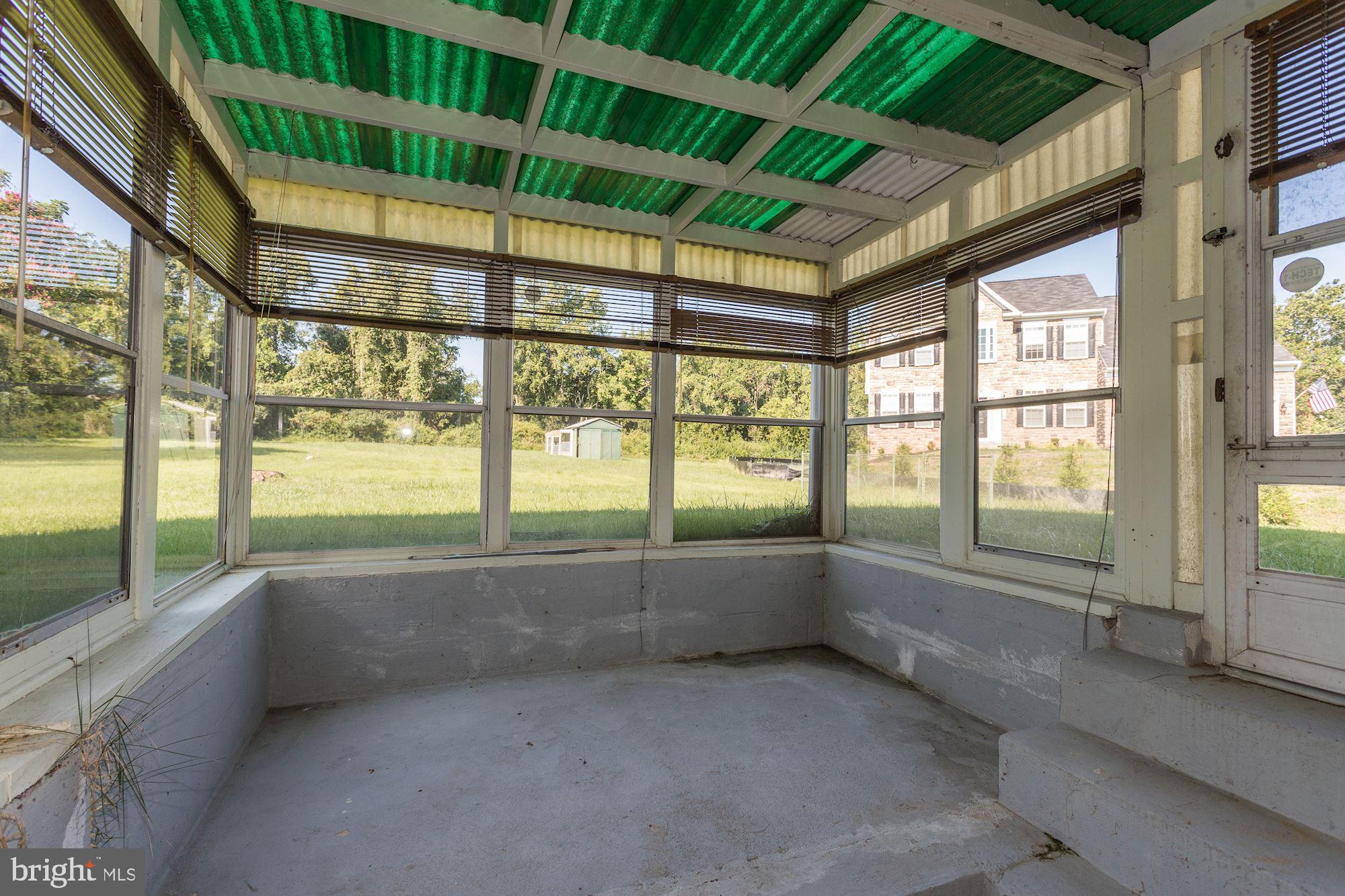 5522 Montgomery Road Ellicott City, MD 21043 - Photo 33 of 42 Enclosed Porch