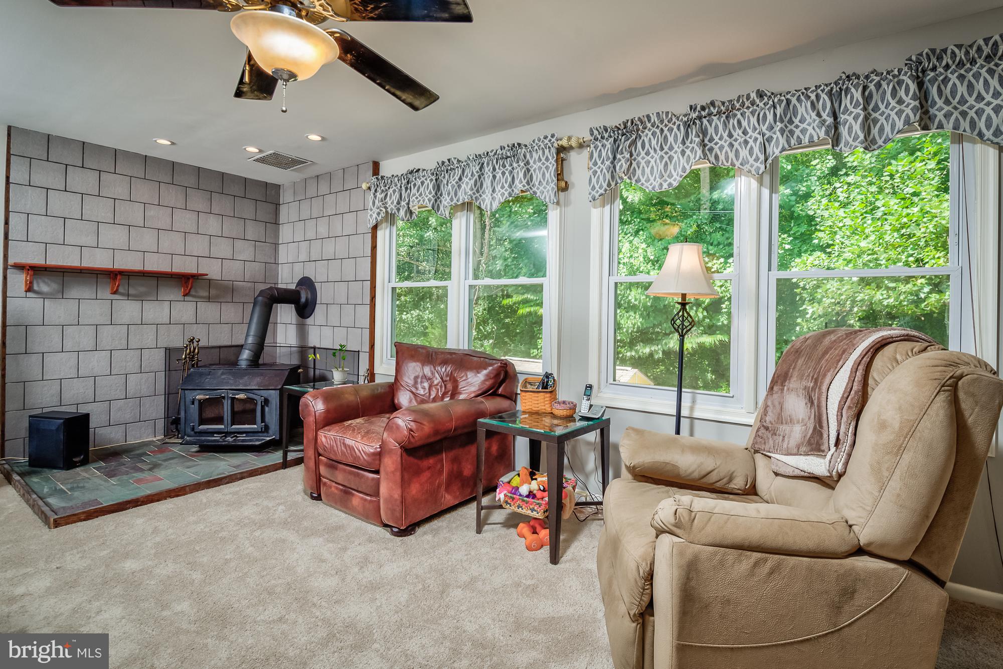 7264 Ridgeway Drive Manassas, VA 20112 - Photo 11 of 27 Wood Stove, Huge Windows overlooking the backyard