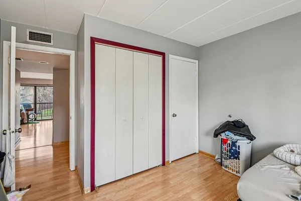 a bedroom with furniture and a window