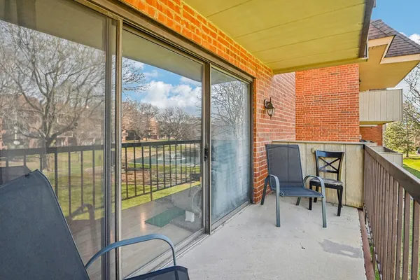 a view of a chair and table in the balcony