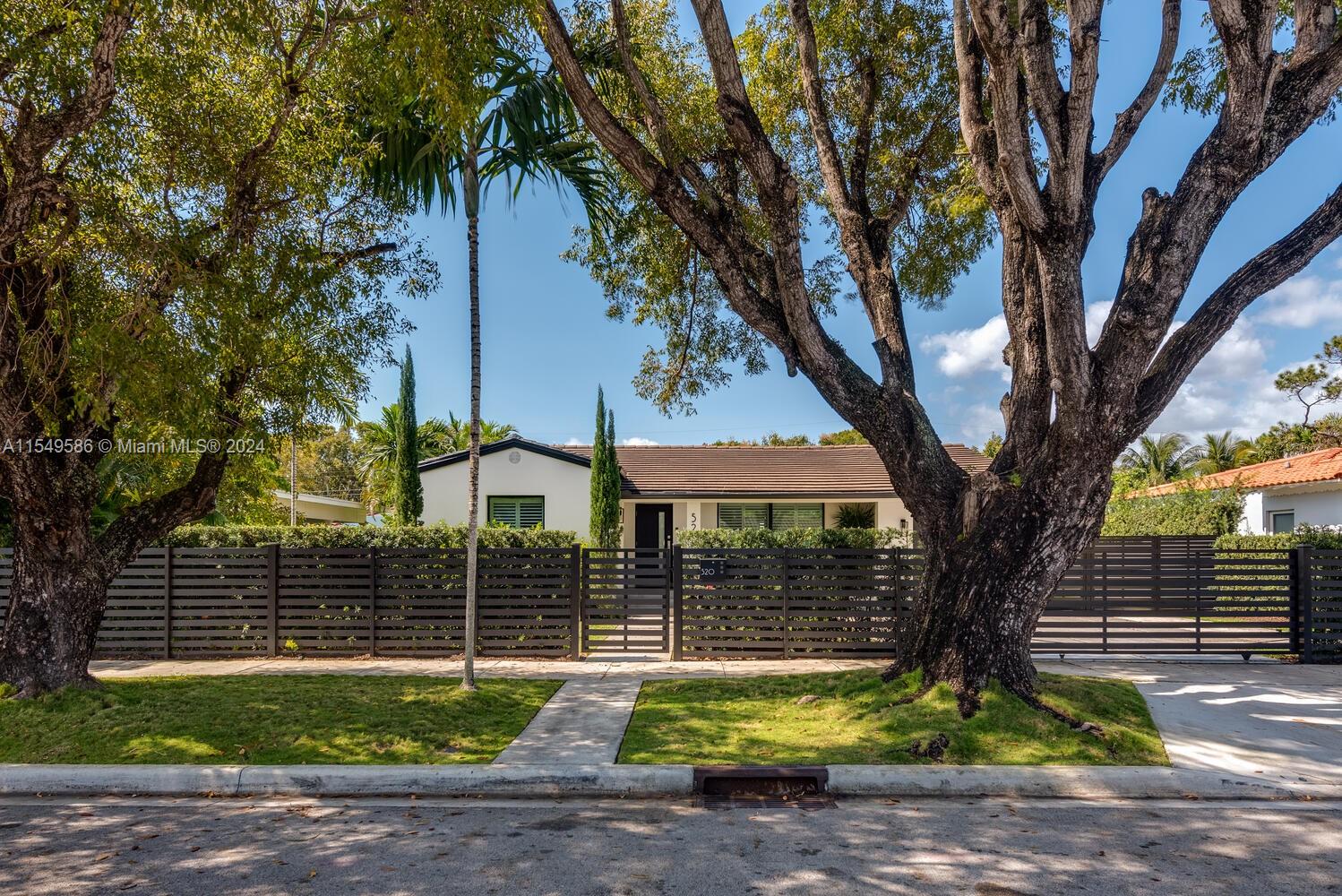 520 Southwest 27th Road Miami, FL 33129 - Photo 1 of 50 a view of a house with backyard and a tree