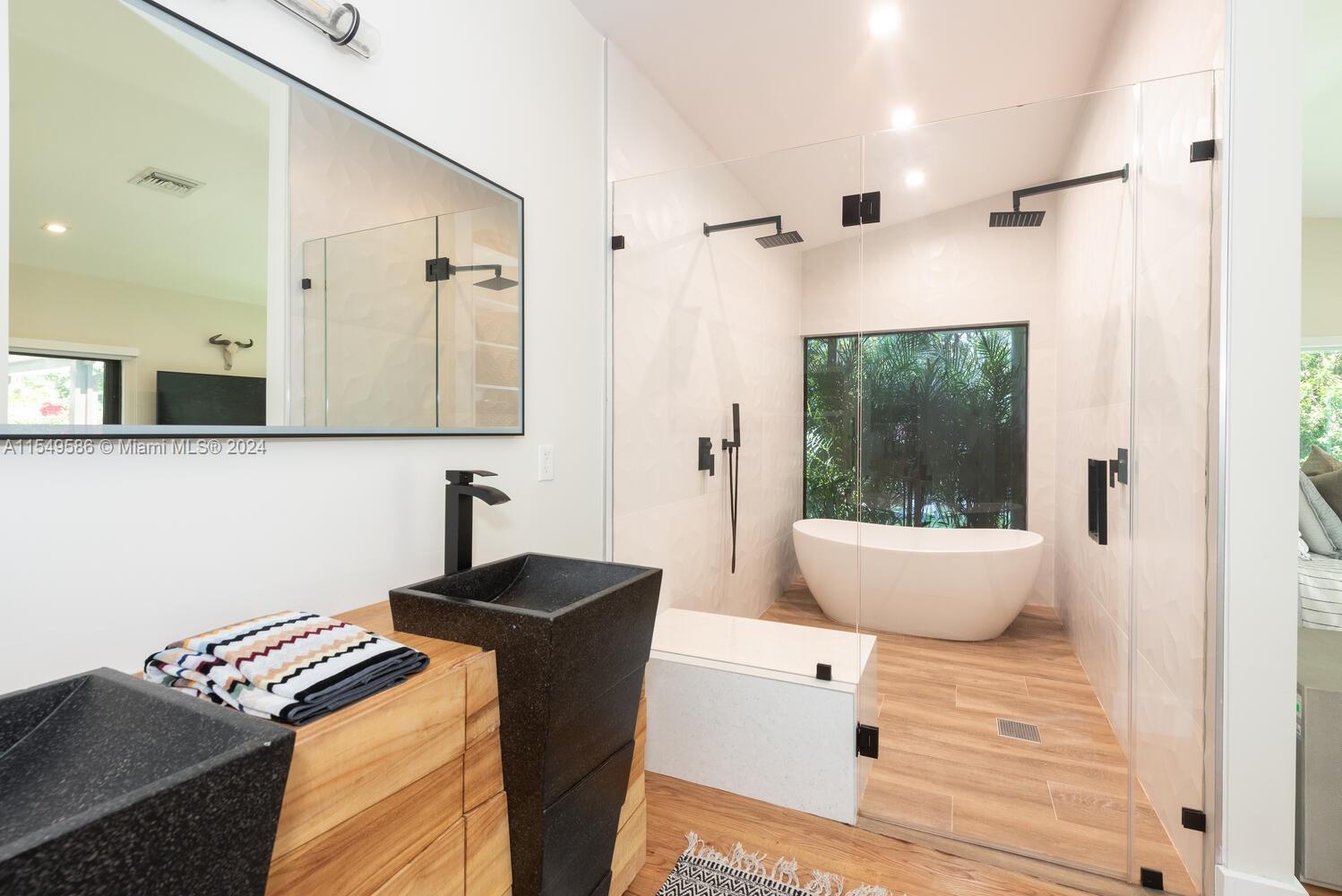 520 Southwest 27th Road Miami, FL 33129 - Photo 19 of 50 a bathroom with a sink and a mirror