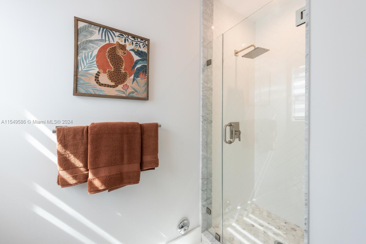 520 Southwest 27th Road Miami, FL 33129 - Photo 25 of 50 a picture of a bathroom with a painting on the wall