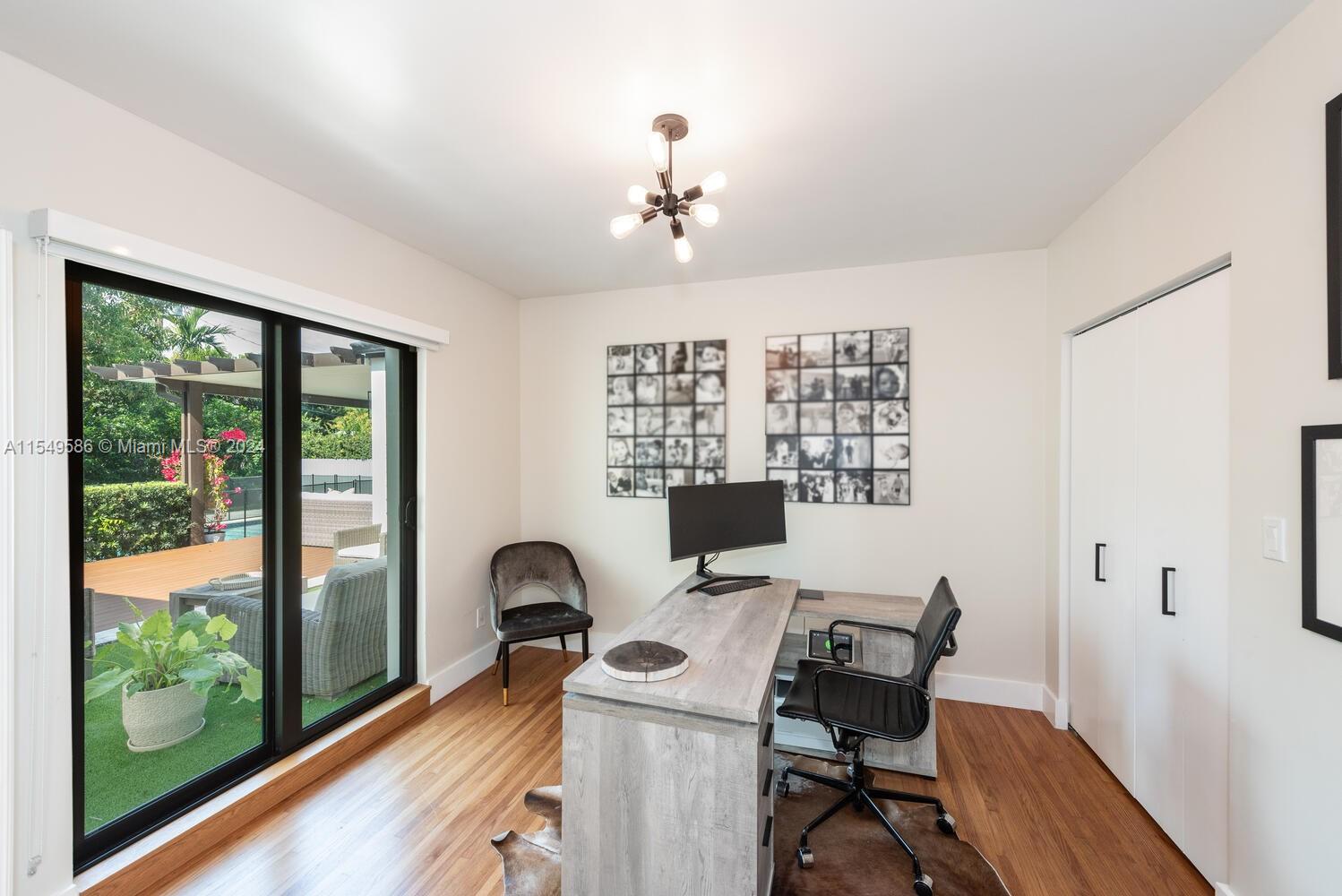 520 Southwest 27th Road Miami, FL 33129 - Photo 29 of 50 a view of a workspace with furniture and a window