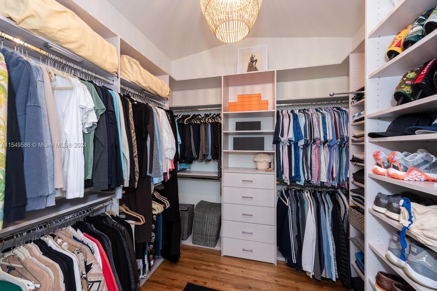 520 Southwest 27th Road Miami, FL 33129 - Photo 30 of 50 a view of walk in closet with clothes and shoes