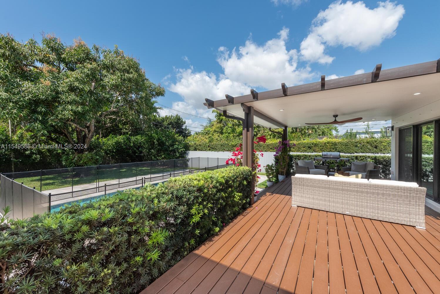 520 Southwest 27th Road Miami, FL 33129 - Photo 34 of 50 a view of a patio with couches table and chairs and potted plants