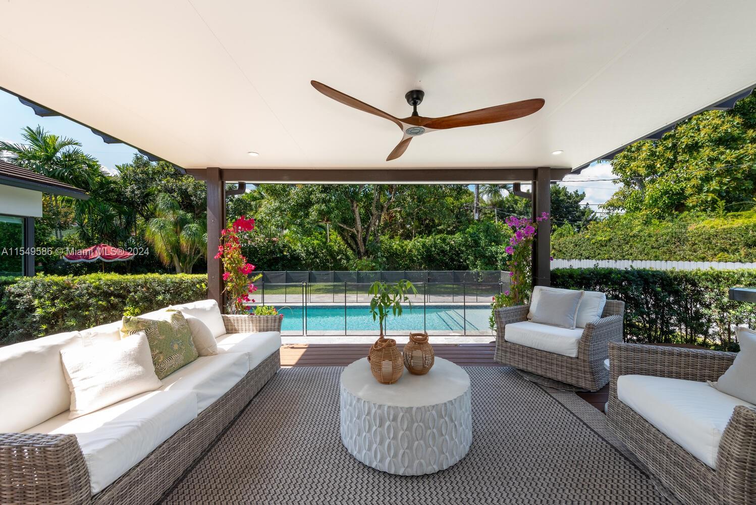 520 Southwest 27th Road Miami, FL 33129 - Photo 4 of 50 a view of a patio with couches chairs and a yard