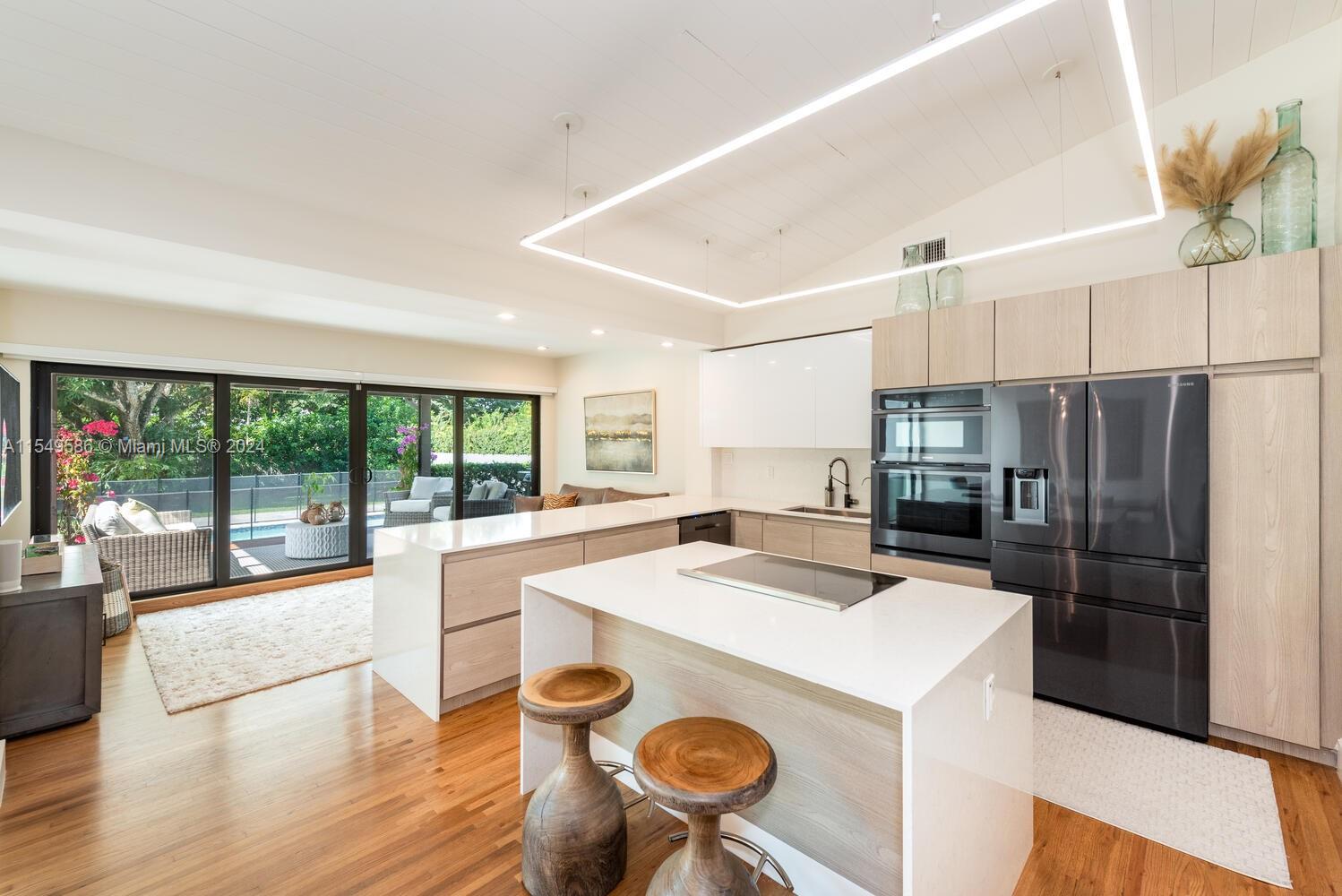 520 Southwest 27th Road Miami, FL 33129 - Photo 6 of 50 a kitchen with refrigerator and windows