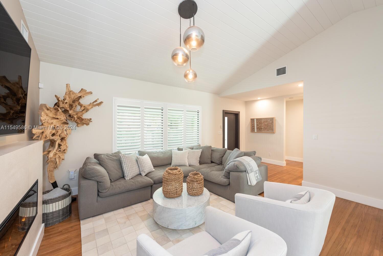 520 Southwest 27th Road Miami, FL 33129 - Photo 10 of 50 a living room with furniture and a large window