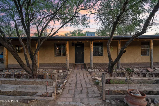 a bedroom with a bed dresser and a window