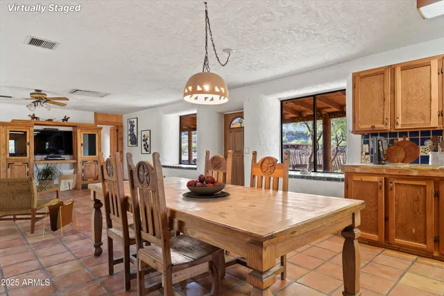 a very nice looking room with a large window and chandelier