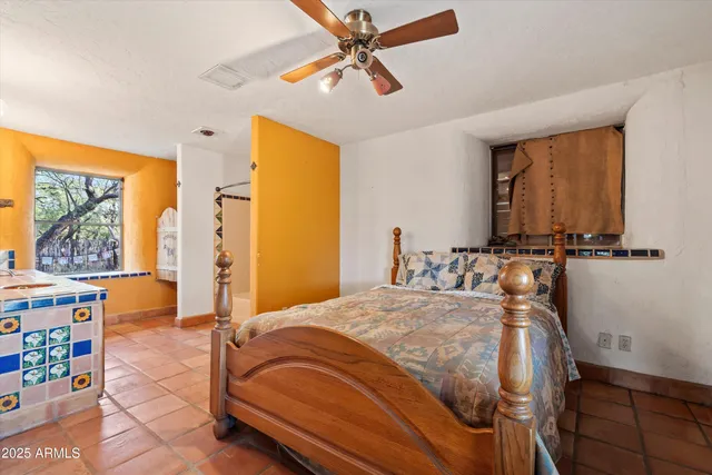 a view of a porch with furniture and a backyard