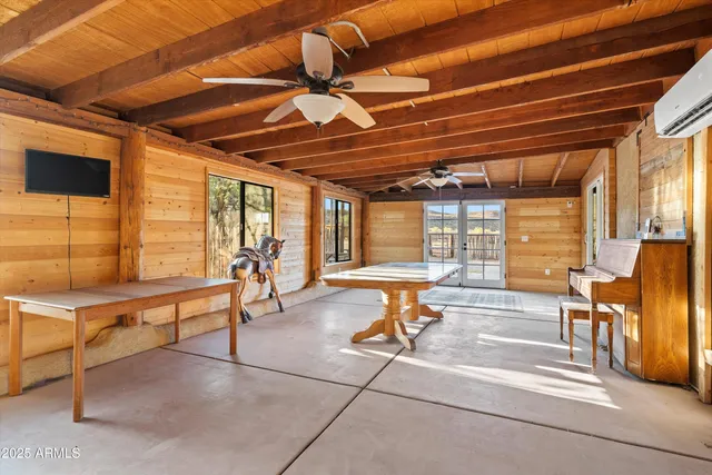 a view of a house with pool table and chairs