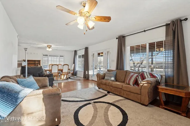 a front view of a house with wooden floor and windows