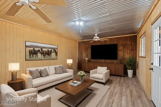 a view of a yard with wooden fence