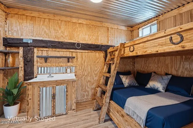 a view of a swimming pool with lawn chairs under an umbrella