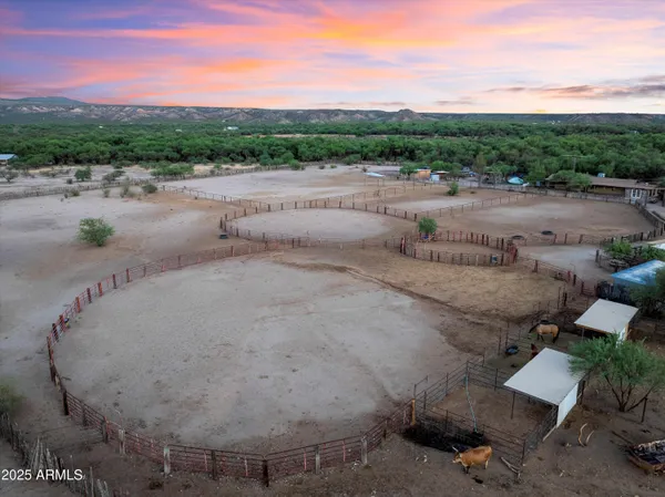 a front view of house with trees in the background