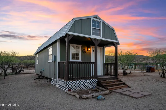 a dining hall with stainless steel appliances a table and chairs