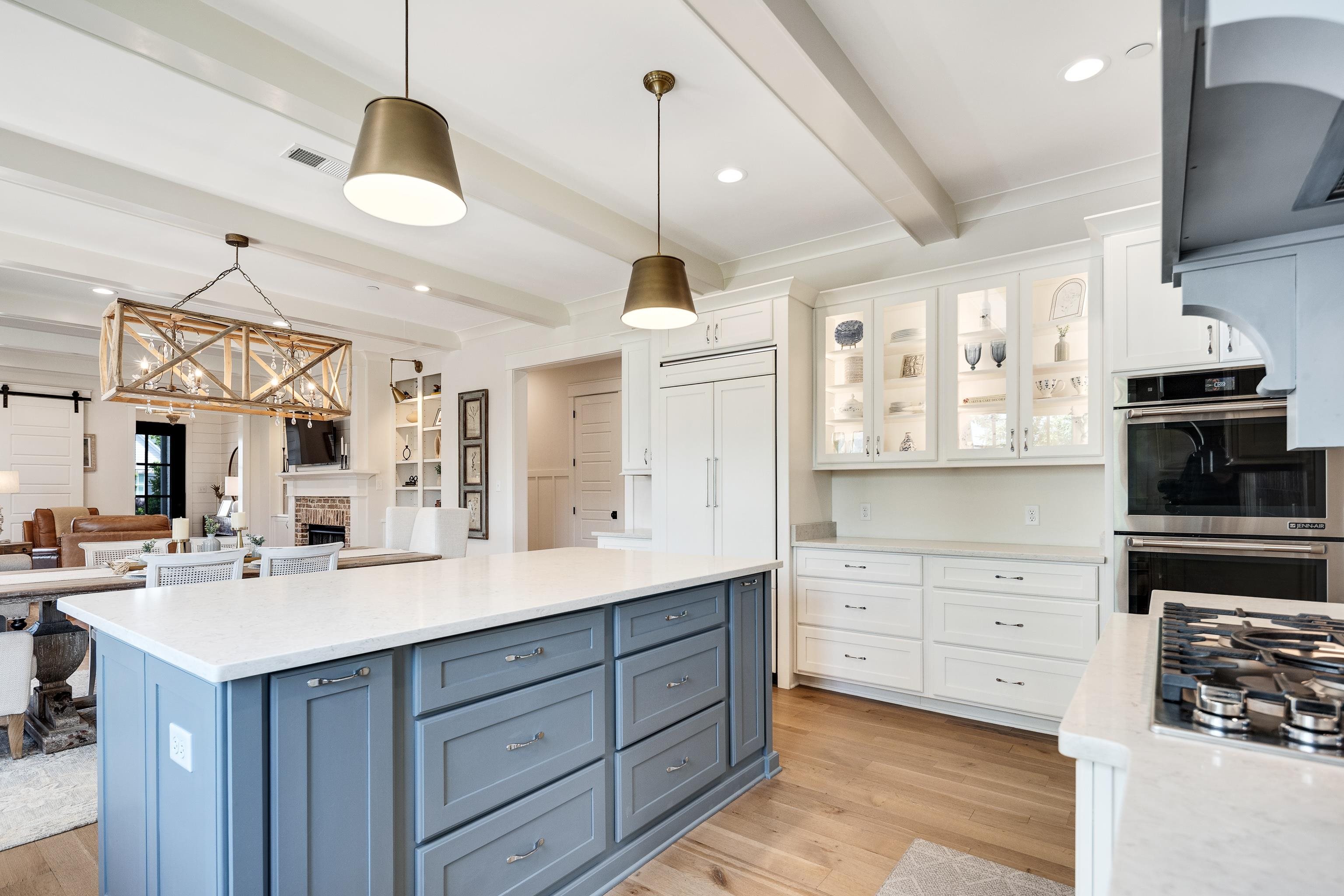 100 Sunflower View Road Piperton, TN 38017 - Photo 13 of 29 Spacious kitchen featuring a central island with blue cabinetry, white countertops, stainless steel appliances, and wood-finish flooring