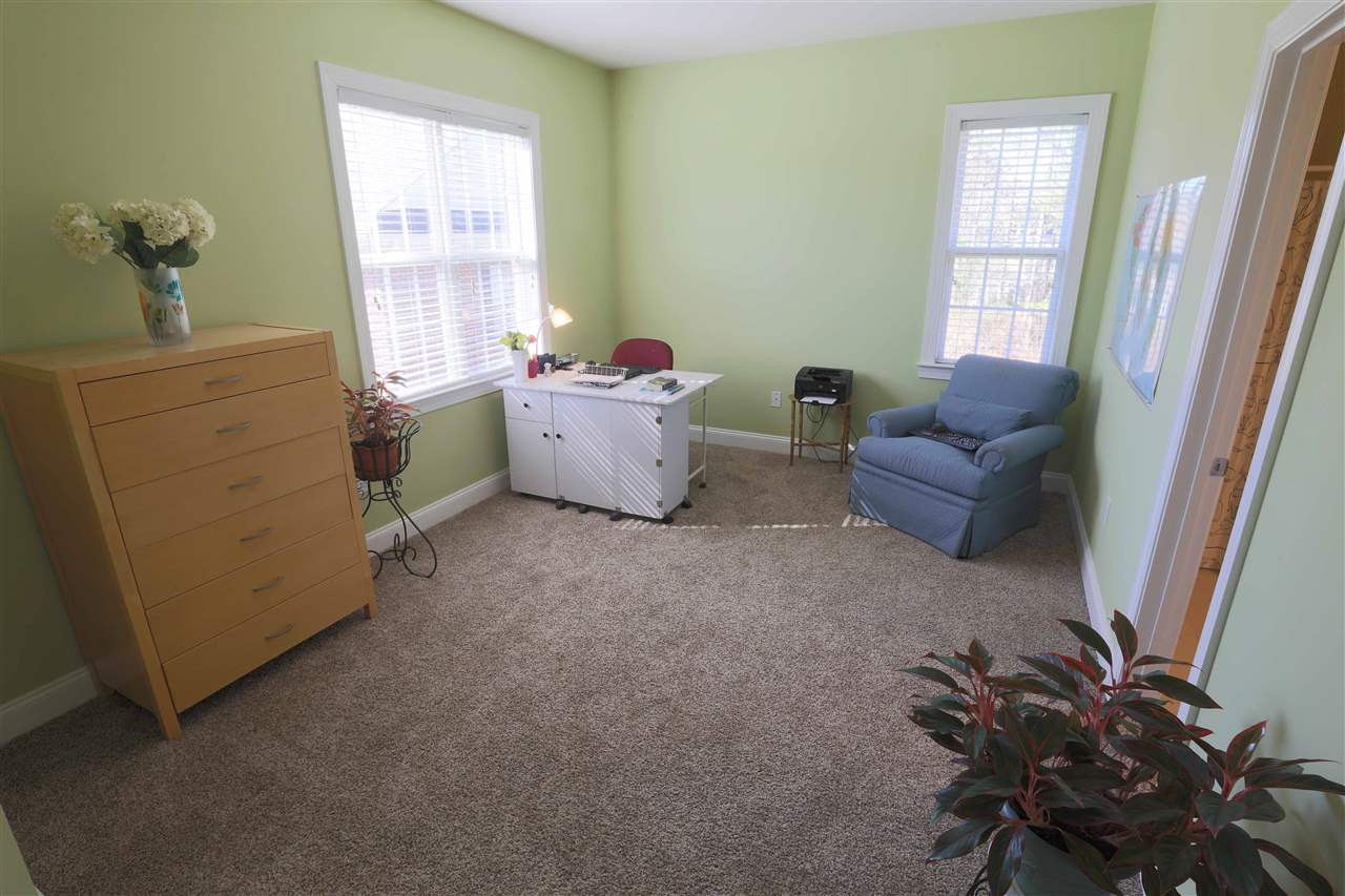 136 West Savannah Ridge Road Holly Springs, NC 27540 - Photo 18 of 24 Guest bedroom with walk in closet