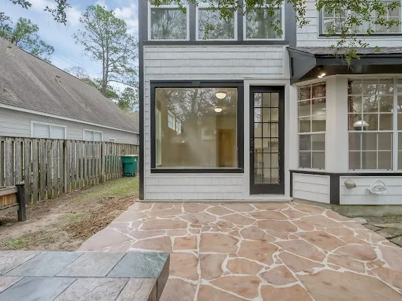 a view of a house with a backyard