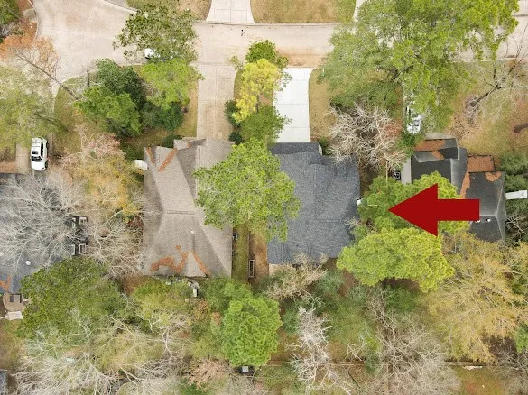 an aerial view of a house with outdoor space