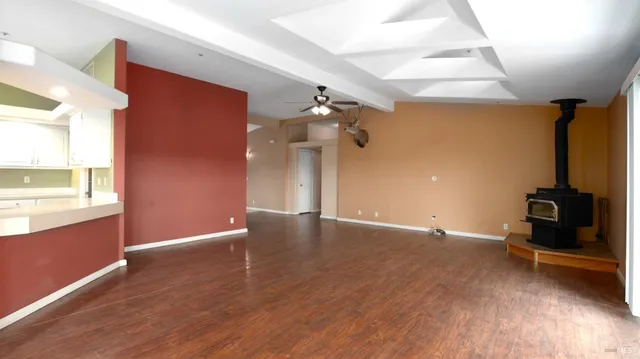 a dining room with furniture window and wooden floor