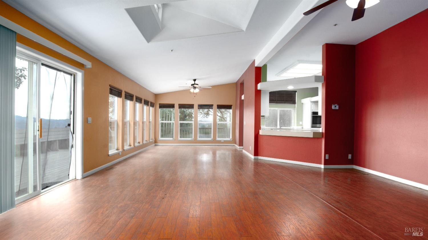 505 McNair Road Cloverdale, CA 95425 - Photo 13 of 55 a view of an empty room with wooden floor and a window