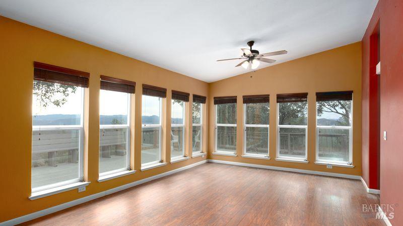 505 McNair Road Cloverdale, CA 95425 - Photo 17 of 58 a view of an empty room with a window and wooden floor