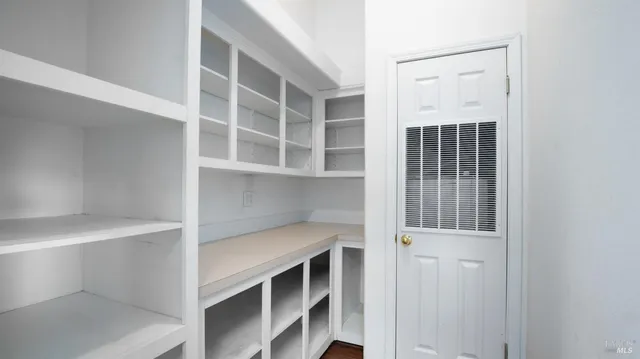 a utility room with sink dryer and washer