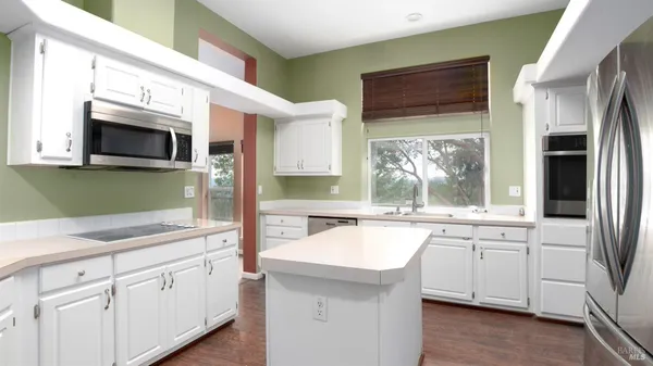 a bathroom with a double vanity sink and mirror