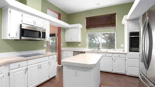 a utility room with sink dryer and washer