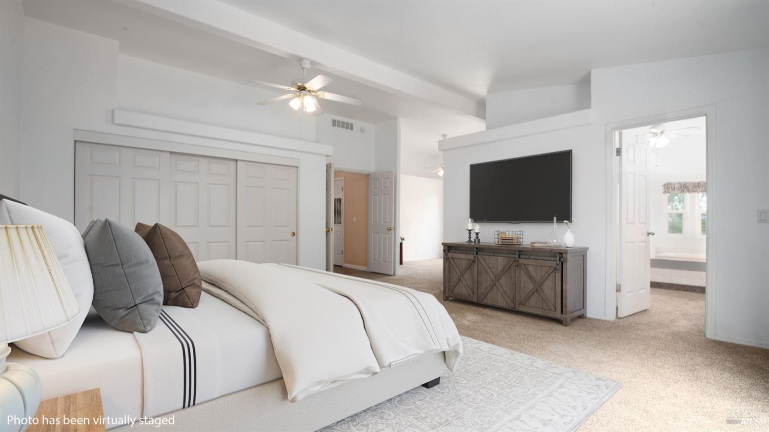 505 McNair Road Cloverdale, CA 95425 - Photo 22 of 55 a bedroom with a bed and a flat screen tv