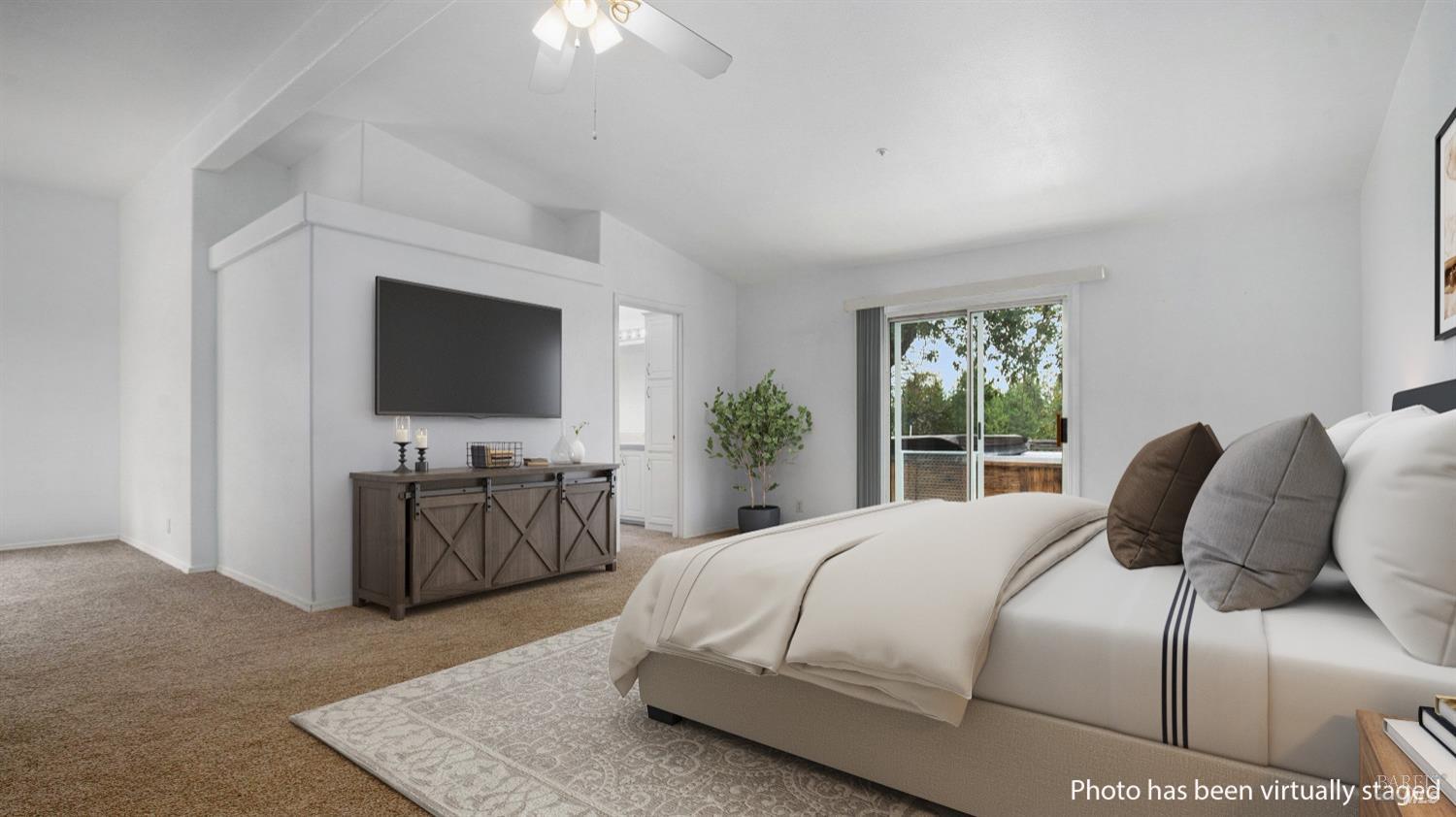 505 McNair Road Cloverdale, CA 95425 - Photo 23 of 55 a bedroom with a large bed and a flat tv screen on a dresser