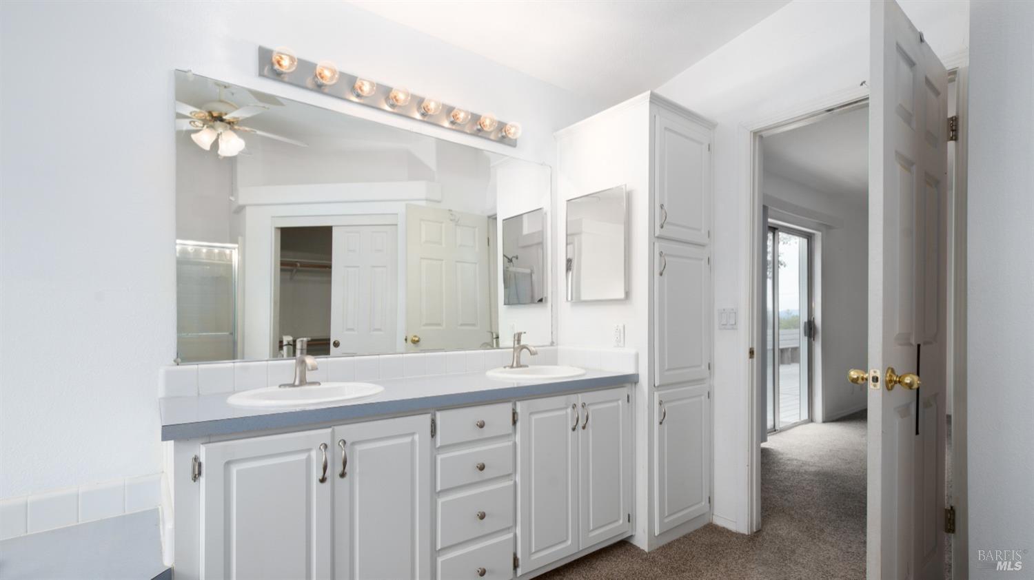505 McNair Road Cloverdale, CA 95425 - Photo 31 of 58 a bathroom with a double vanity sink and mirror