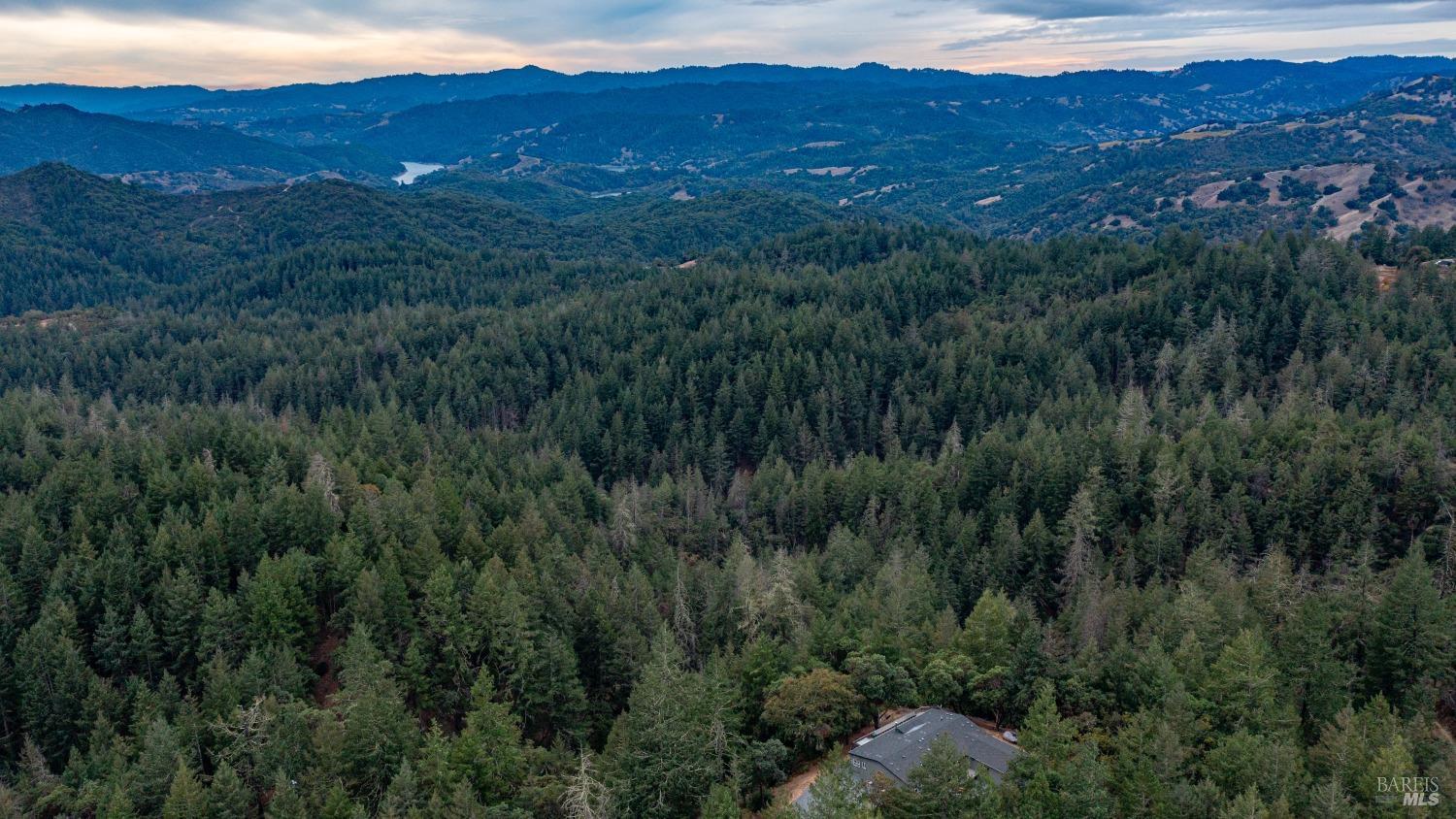 505 McNair Road Cloverdale, CA 95425 - Photo 49 of 55 a view of a lush green hillside and a houses