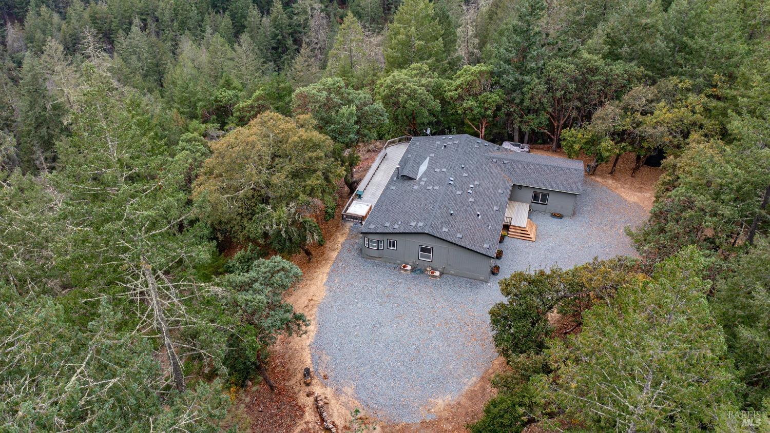 505 McNair Road Cloverdale, CA 95425 - Photo 50 of 58 an aerial view of a house with yard and trees in the background