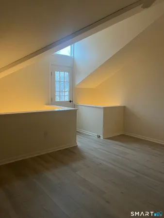 a bathroom with a toilet a sink and a mirror
