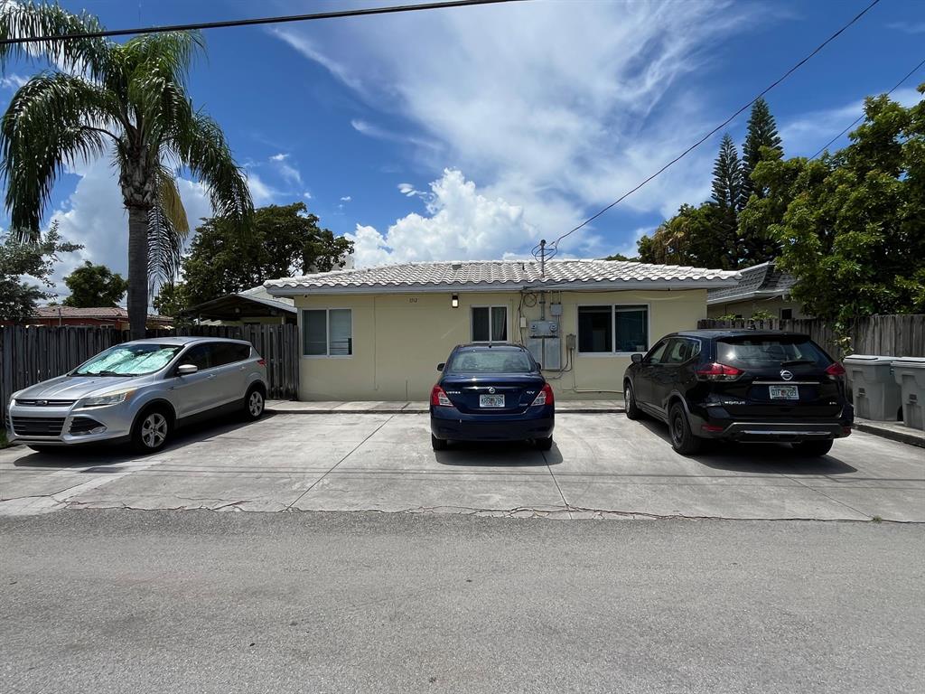 1712 Fletcher Street, Unit 5 Hollywood, FL 33020 - Photo 11 of 11 a view of a car parked in front of a house