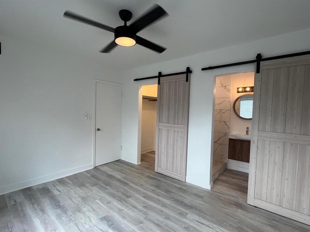 1712 Fletcher Street, Unit 5 Hollywood, FL 33020 - Photo 4 of 11 a view of empty room with wooden floor and ceiling fan