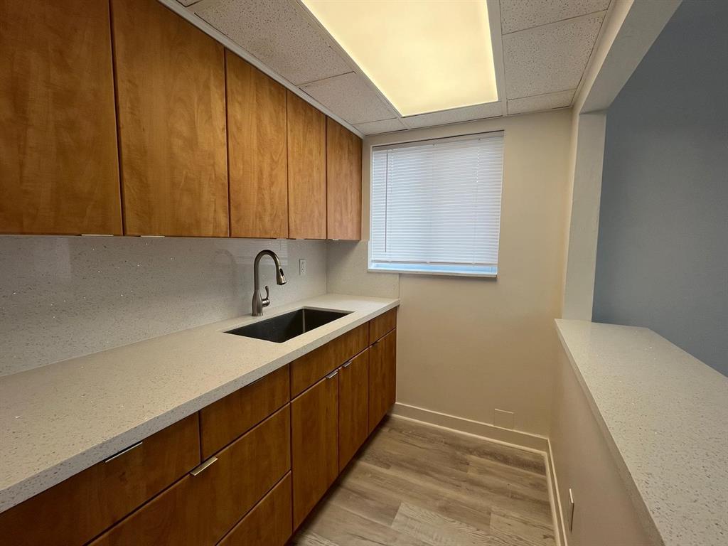1712 Fletcher Street, Unit 5 Hollywood, FL 33020 - Photo 8 of 11 a kitchen with a sink and cabinets
