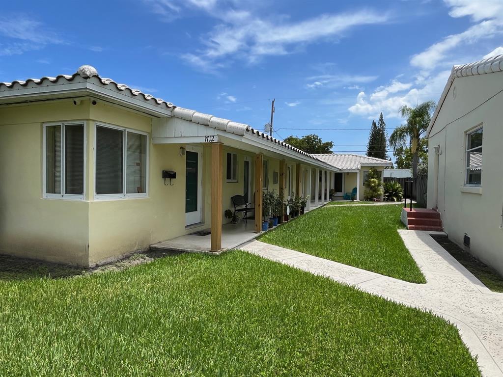 1712 Fletcher Street, Unit 5 Hollywood, FL 33020 - Photo 10 of 11 a view of a house with a yard
